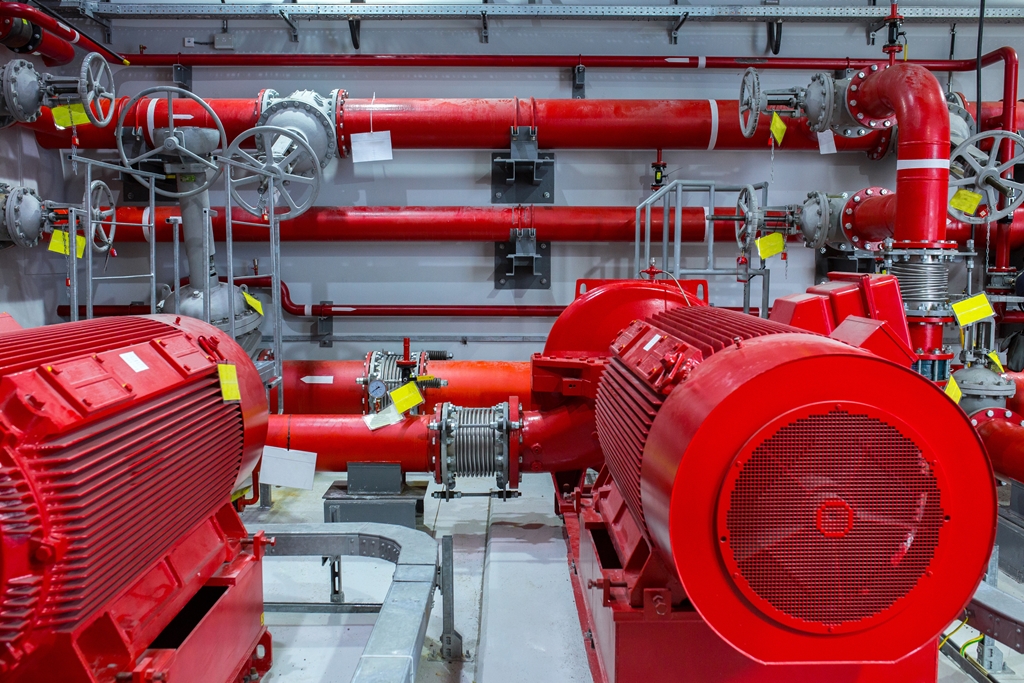 Industrial fire pump station. Reliable and trouble-free equipment. Automatic fire extinguishing system control system. Powerful electric water pump, valves, and pipelines for water sprinkler.